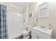 Bright bathroom with a shower, a modern sink, and updated fixtures at 11777 Elizabeth Cir, Thornton, CO 80233