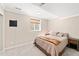 Cozy bedroom featuring soft lighting, neutral decor, and a sliding glass door at 11777 Elizabeth Cir, Thornton, CO 80233