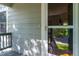 View of the front porch, screen door and stone accents of the home at 11777 Elizabeth Cir, Thornton, CO 80233