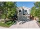 Charming two-story home with a well-maintained lawn, mature trees, and an attached two-car garage at 11777 Elizabeth Cir, Thornton, CO 80233