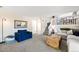 Spacious living room with an open layout and access to the upper floor at 11777 Elizabeth Cir, Thornton, CO 80233