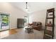 Bright living room with neutral walls, carpet, and plenty of natural light at 11777 Elizabeth Cir, Thornton, CO 80233