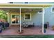 Covered patio featuring comfortable seating, string lights, and outdoor dining area at 11777 Elizabeth Cir, Thornton, CO 80233