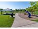 Well-maintained community playground with picnic shelter, swings, and slide for endless fun at 11777 Elizabeth Cir, Thornton, CO 80233