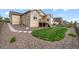 Backyard with small grass area, low maintenance gravel, and flagstone walkway at 17956 Gypsum Canyon Ct, Monument, CO 80132