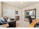 Home office setup with workspace, shelving, seating and a spacious closet at 17956 Gypsum Canyon Ct, Monument, CO 80132