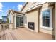 Outdoor deck featuring a stucco fireplace, sliding glass door and composite decking at 17956 Gypsum Canyon Ct, Monument, CO 80132