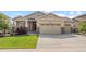 Charming home featuring a three-car garage and meticulously maintained front yard at 17956 Gypsum Canyon Ct, Monument, CO 80132