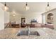 Open-concept kitchen with granite countertops, stainless steel sink, and an island at 17956 Gypsum Canyon Ct, Monument, CO 80132
