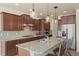 Gourmet kitchen with stainless steel appliances, granite countertops, and custom cabinetry at 17956 Gypsum Canyon Ct, Monument, CO 80132