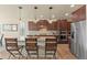 Beautiful kitchen with stainless steel appliances, wood floors, and pendant lighting at 17956 Gypsum Canyon Ct, Monument, CO 80132