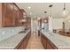 Modern kitchen featuring stone countertops, gas range, stainless steel appliances, and sleek cabinetry at 17956 Gypsum Canyon Ct, Monument, CO 80132