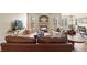 Cozy living room featuring a stone fireplace and comfortable seating at 17956 Gypsum Canyon Ct, Monument, CO 80132