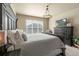 Comfortable main bedroom with dark wood furnishings, a window with blinds, and neutral decor at 17956 Gypsum Canyon Ct, Monument, CO 80132