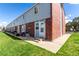 This townhouse has a modest backyard with green grass at 6450 Tennyson St # 1, Arvada, CO 80003