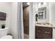 Updated bathroom with a tiled shower, modern vanity, and neutral decor at 6450 Tennyson St # 1, Arvada, CO 80003