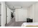 This bedroom features a double closet, an open door way, and neutral paint at 6450 Tennyson St # 1, Arvada, CO 80003