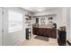 Coffee bar area with custom shelving and tiled backsplash, perfect for the home barista at 6450 Tennyson St # 1, Arvada, CO 80003