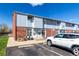 Well-maintained townhouse complex with ample parking and attractive brick and siding at 6450 Tennyson St # 1, Arvada, CO 80003