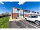 Attractive multi-Gathering unit with neat landscaping, paved parking, and brick accents at 6450 Tennyson St # 1, Arvada, CO 80003