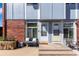 Charming townhouse featuring a welcoming front bench and a well-maintained entryway at 6450 Tennyson St # 1, Arvada, CO 80003