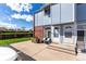 Inviting townhouse featuring a cozy front porch with seating and vibrant landscaping at 6450 Tennyson St # 1, Arvada, CO 80003
