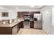 Well-equipped kitchen with stainless steel appliances, granite countertops, and ample cabinet space at 6450 Tennyson St # 1, Arvada, CO 80003
