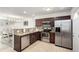 Spacious kitchen with stainless steel appliances, granite countertops, and access to the dining area at 6450 Tennyson St # 1, Arvada, CO 80003