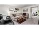 Inviting living room with comfortable seating, a wooden coffee table, and modern decor at 6450 Tennyson St # 1, Arvada, CO 80003