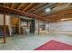 This unfinished basement offers exposed rafters, ample storage, and an egress window at 581 N Flat Rock Cir, Aurora, CO 80018