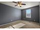 Bedroom with carpet, ceiling fan and window at 581 N Flat Rock Cir, Aurora, CO 80018