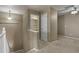 This hallway leads to a full bathroom and bedroom with a ceiling fan at 581 N Flat Rock Cir, Aurora, CO 80018