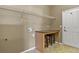 This laundry room features overhead storage, a built-in folding table, and room for side-by-side washer and dryer hookups at 581 N Flat Rock Cir, Aurora, CO 80018