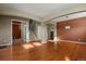Hardwood floor living room with access to office and staircase at 581 N Flat Rock Cir, Aurora, CO 80018