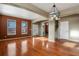 Spacious living room with hardwood floors and a view of the staircase at 581 N Flat Rock Cir, Aurora, CO 80018