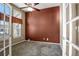 Bright office space with carpet, a ceiling fan, natural light, and glass French doors at 581 N Flat Rock Cir, Aurora, CO 80018