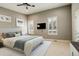A serene bedroom with plush carpet, ample natural light, and a ceiling fan for added comfort at 2624 S Race St, Denver, CO 80210