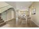 Elegant dining area with a glass-railed staircase and a modern marble-topped table at 2624 S Race St, Denver, CO 80210