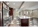 Modern kitchen featuring an island, stainless steel appliances, and hexagon-tiled flooring at 2624 S Race St, Denver, CO 80210