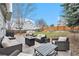 Large backyard featuring a stone patio, outdoor seating, firepit, and plenty of space for entertaining at 23813 Broadmoor Dr, Parker, CO 80138
