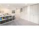 Well lit basement featuring a play area, storage, and sectional sofa at 23813 Broadmoor Dr, Parker, CO 80138