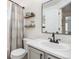 Well-lit bathroom with a vanity and a shower-tub combo featuring neutral tones and fixtures at 23813 Broadmoor Dr, Parker, CO 80138