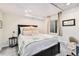 Cozy bedroom with a comfortable bed, side table, and natural light at 23813 Broadmoor Dr, Parker, CO 80138