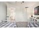 View of a bedroom leading to a bathroom, including closet and decor at 23813 Broadmoor Dr, Parker, CO 80138