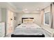 Comfortable bedroom featuring a cozy bed, a side table, and an en-suite bathroom at 23813 Broadmoor Dr, Parker, CO 80138