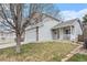 Charming two-story home with attached garage and inviting porch, showcasing the well-kept lawn at 23813 Broadmoor Dr, Parker, CO 80138