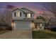 Charming two-story home featuring a two-car garage, inviting porch, and well-maintained lawn at 23813 Broadmoor Dr, Parker, CO 80138