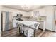 Modern kitchen features a large island, stainless steel appliances, and ample counter space at 23813 Broadmoor Dr, Parker, CO 80138