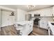 Well-appointed kitchen with stainless steel appliances, white cabinetry, and quartz countertops at 23813 Broadmoor Dr, Parker, CO 80138