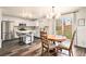 Bright kitchen and dining area with stainless steel appliances and access to backyard at 23813 Broadmoor Dr, Parker, CO 80138